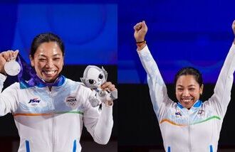 Mirabai Chanu holds a silver medal after competing in the Women's 49kg Group A weightlifting final match during the 20th Asian Games, in Nagoya, Japan.