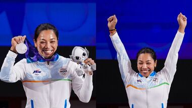 Mirabai Chanu holds a silver medal after competing in the Women's 49kg Group A weightlifting final match during the 20th Asian Games, in Nagoya, Japan.