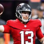 Cooper Rush #13 of the Atlanta Falcons looks to pass against the Carolina Panthers during the second quarter of the game at Mercedes-Benz Stadium.