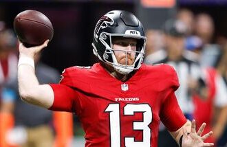 Cooper Rush #13 of the Atlanta Falcons looks to pass against the Carolina Panthers during the second quarter of the game at Mercedes-Benz Stadium.