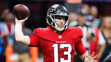 Cooper Rush #13 of the Atlanta Falcons looks to pass against the Carolina Panthers during the second quarter of the game at Mercedes-Benz Stadium.