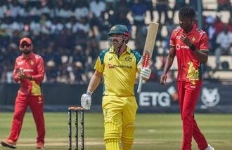 Australia's Travis Head celebrates after scoring a century during the second ODI against Zimbabwe in Harare on Friday.