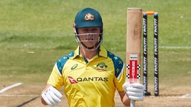 Australia's Cooper Connolly raises his bat on scoring a half-century in the second ODI against Zimbabwe.