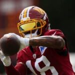 Stefon Diggs #18 of the Washington Commanders participates in a drill during a joint practice.