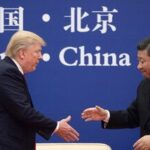 In this file photo, China's President Xi Jinping shakes hands with US President Donald Trump (L) during a business leaders event at the Great Hall of the People in Beijing on November 9, 2017.