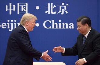 In this file photo, China's President Xi Jinping shakes hands with US President Donald Trump (L) during a business leaders event at the Great Hall of the People in Beijing on November 9, 2017.