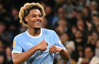 Manchester City's French midfielder #75 Floyd Samba celebrates scoring the team's fourth goal during the English League Cup third round football match between Manchester City and Norwich City at the Etihad stadium in Manchester, northwest England.