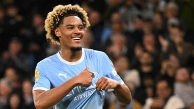 Manchester City's French midfielder #75 Floyd Samba celebrates scoring the team's fourth goal during the English League Cup third round football match between Manchester City and Norwich City at the Etihad stadium in Manchester, northwest England.