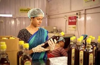 A member of the Aapni Saheli Farmer Producer Co. in Dholpur, Rajasthan, at a cooking oil packaging unit which supplies to KisaanSay, a brand selling regional produce.
