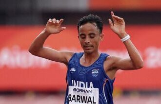 India's Sawan Barwal crosses the finish line in second place to win the silver in the Men's Marathon final at the 2026 Asian Games in Aichi-Nagoya on Saturday.