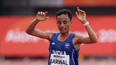 India's Sawan Barwal crosses the finish line in second place to win the silver in the Men's Marathon final at the 2026 Asian Games in Aichi-Nagoya on Saturday.