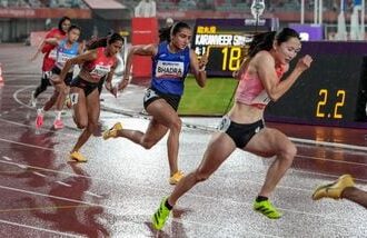 India's Harita Bhadra (C) in action during her women's 200m event at Asian Games 2026.