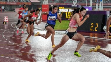 India's Harita Bhadra (C) in action during her women's 200m event at Asian Games 2026.