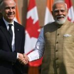 Mark Carney, Canada's prime minister, left, shakes hands with Narendra Modi, India's prime minister, prior to a meeting at Hyderabad House in New Delhi, India, on Monday, March 2, 2026.