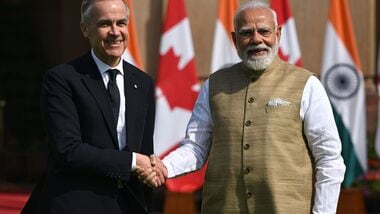 Mark Carney, Canada's prime minister, left, shakes hands with Narendra Modi, India's prime minister, prior to a meeting at Hyderabad House in New Delhi, India, on Monday, March 2, 2026.
