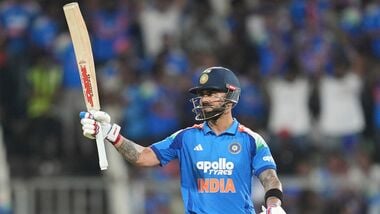 India's Virat Kohli celebrates his fifty runs during the first one day international cricket match between India and West Indies in Thiruvananthapuram, India.