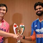 India's captain Shreyas Iyer (R) shakes hands with Japanese captain Kendel Kadowaki-Fleming during a press conference ahead of the one-off T20I.