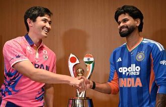 India's captain Shreyas Iyer (R) shakes hands with Japanese captain Kendel Kadowaki-Fleming in Tokyo.