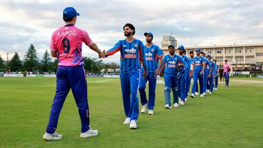 The Indian players shake hands with their Japanese counterparts after winning the historic one-off T20I in Sano.