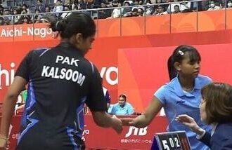 India's Syndrela Das (in blue)  shakes hand with her Pakistani opponent Kalsoom Khan at Asian Games 2026.