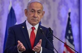 Israeli Prime Minister Benjamin Netanyahu speaks to the audience at a conference in Jerusalem, Sunday, July 27, 2025.