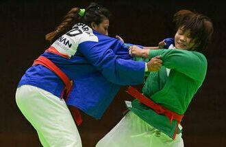 India's Pincky Balhara (in blue) and South Korea's Lim Ga-ram (in green) compete in the women's under 78kg quarter-final kurash event a the 2026 Asian Games in Nagoya.
