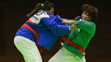 India's Pincky Balhara (in blue) and South Korea's Lim Ga-ram (in green) compete in the women's under 78kg quarter-final kurash event a the 2026 Asian Games in Nagoya.