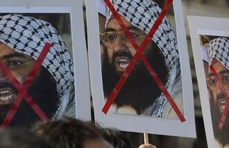 Activists carry placards of the chief of Jaish-e-Mohammad, Maulana Masood Azhar during a protest against the attack on the air force base in Pathankot.