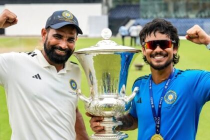 East Zone's captain Ishan Kishan (R) and Mohammed Shami pose with the trophy after winning the Duleep Trophy 2026.
