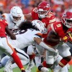 Kenneth Walker III #9 of the Kansas City Chiefs runs the ball against the Denver Broncos during the first quarter in the game at Arrowhead Stadium.