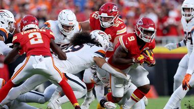 Kenneth Walker III #9 of the Kansas City Chiefs runs the ball against the Denver Broncos during the first quarter in the game at Arrowhead Stadium.