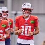New England Patriots quarterback Drake Maye (10) runs during an NFL football practice.