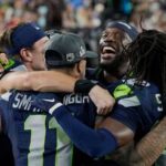 Seattle Seahawks players celebrate on the sideline late in the game against the New England Patriots during the NFL Super Bowl 60 football game. 9file photo)