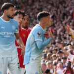 Manchester City's Phil Foden remonstrates with referee Michael Oliver after being shown a red card against Manchester United.