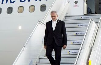 Iranian President Masoud Pezeshkian debarking an aircraft upon his arrival in New Delhi for the 2026 BRICS summit. (@MEAIndia/X via PTI Photo)
