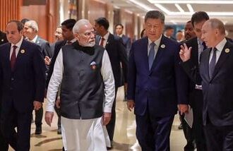 Prime Minister Narendra Modi interacts with Russian President Vladimir Putin and Chinese President Xi Jinping during the 18th BRICS Summit in New Delhi.