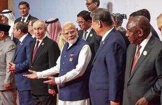 Prime Minister Narendra Modi with Russian President Vladimir Putin, Chinese President Xi Jinping, Iranian President Masoud Pezeshkian, Egyptian President Abdel Fattah el-Sisi, Indonesian President Prabowo Subianto, South African President Cyril Ramaphosa and others during a group photograph at the 18th BRICS Summit, in New Delhi.
