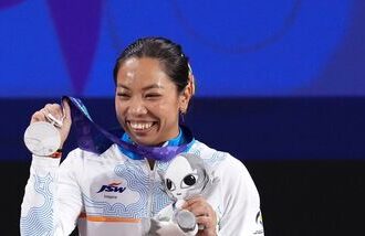 India's Mirabai Chanu poses with her silver medal at the 2026 Asian Games in Nagoya.