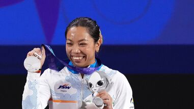 India's Mirabai Chanu poses with her silver medal at the 2026 Asian Games in Nagoya.