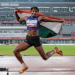 India's Ancy Sojan celebrates after winning silver medal in the women's long jump final event at the ongoing 20th Asian Games, in Nagoya, Japan.