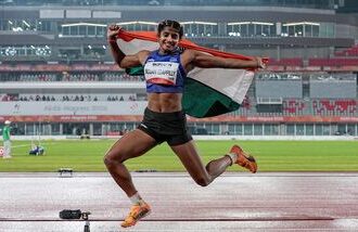 India's Ancy Sojan celebrates after winning silver medal in the women's long jump final event at the ongoing 20th Asian Games, in Nagoya, Japan.