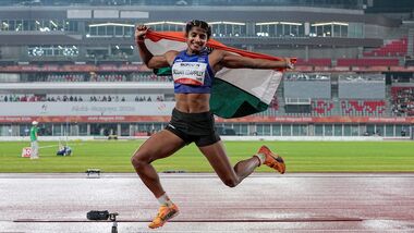India's Ancy Sojan celebrates after winning silver medal in the women's long jump final event at the ongoing 20th Asian Games, in Nagoya, Japan.