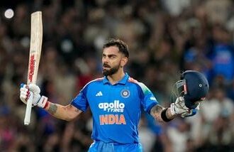 India's Virat Kohli celebrates his century during the first One Day International (ODI) cricket match between India and West Indies, in Thiruvananthapuram.