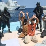 Security personnel detain five Pakistani nationals and seized 526 kg of methamphetamine and heroin valued at more than  ₹3,000 crore from an Iranian boat in the Arabian Sea, after a joint operation by the Indian Coast Guard (ICG) and Gujarat Anti-Terrorism Squad (ATS) near Lakshadweep. (@IndiaCoastGuard/X via PTI Photo)