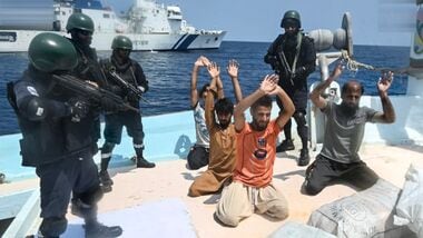 Security personnel detain five Pakistani nationals and seized 526 kg of methamphetamine and heroin valued at more than  ₹3,000 crore from an Iranian boat in the Arabian Sea, after a joint operation by the Indian Coast Guard (ICG) and Gujarat Anti-Terrorism Squad (ATS) near Lakshadweep. (@IndiaCoastGuard/X via PTI Photo)