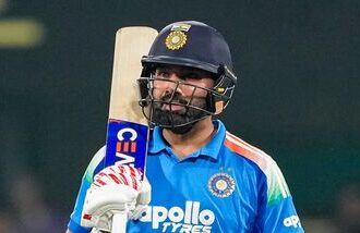 India's Rohit Sharma celebrates his half century during the second One Day International (ODI) cricket match between India and West Indies, in Guwahati, Assam.