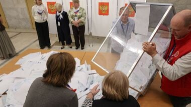 Members of a local electoral commission empty a ballot box before counting votes after the closure of a polling station on the final day of Russia's three-day parliamentary election in the town of Podolsk near Moscow, Russia, September 20, 2026. REUTERS/Ramil Sitdikov