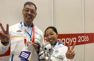 Saikhom Mirabai Chanu (R) and her coach Vijay Sharma in Aichi-Nagoya.