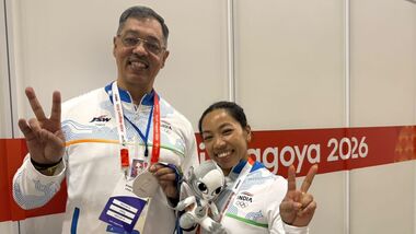 Saikhom Mirabai Chanu (R) and her coach Vijay Sharma in Aichi-Nagoya.