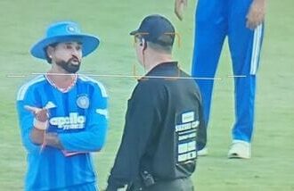 India captain Shreyas Iyer (L) speaks with the on-field umpire over the wide ball in the final over of the match.
